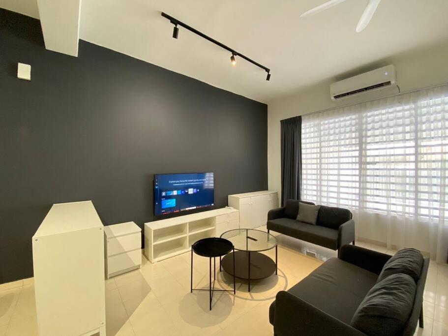 a living room with a couch and a tv at IKEA Modernism House 10Pax`Near Icon City in Bukit Mertajam