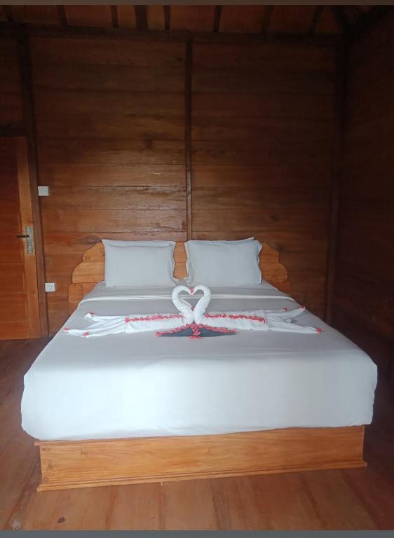 Postel nebo postele na pokoji v ubytování Uma d'Nyuh Homestay