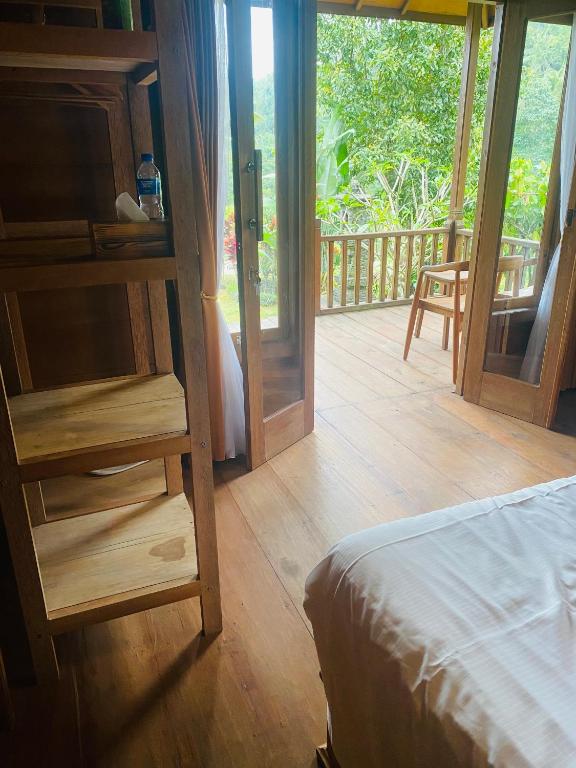 Postel nebo postele na pokoji v ubytování Uma d'Nyuh Homestay