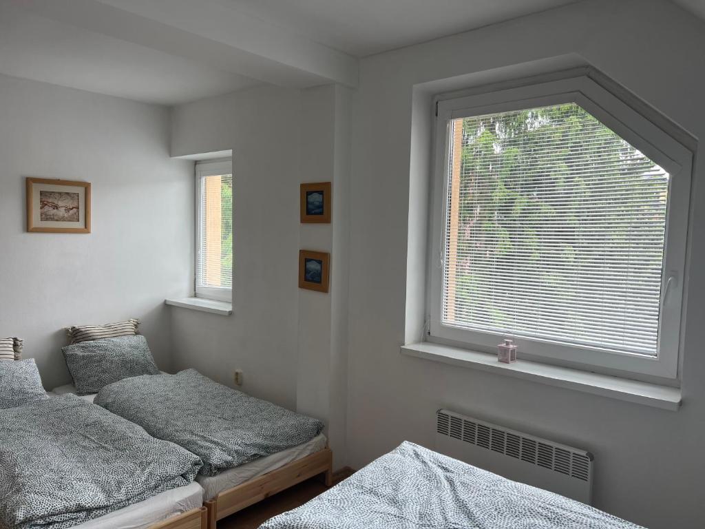 Postel nebo postele na pokoji v ubytování SKI&Fun Donovaly Magura