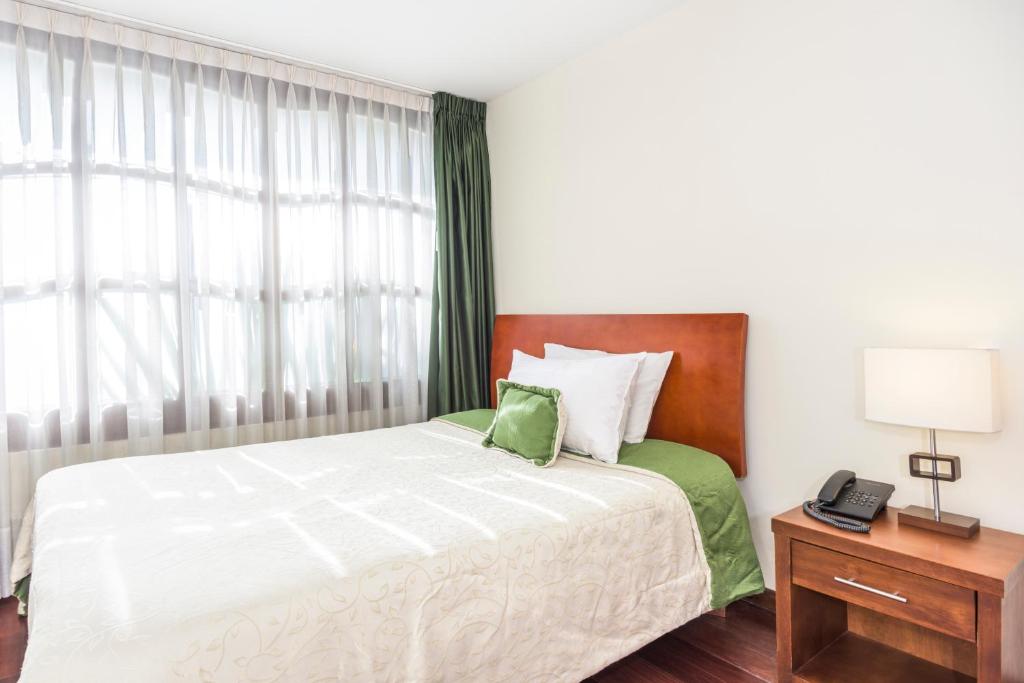 Postel nebo postele na pokoji v ubytování Hotel Portofino