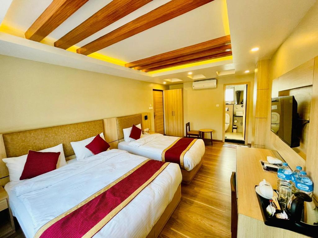 Postel nebo postele na pokoji v ubytování Hotel Aerocity