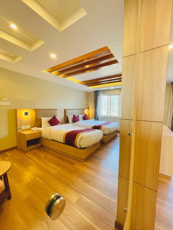 Postel nebo postele na pokoji v ubytování Hotel Aerocity