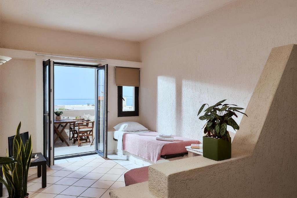 Postel nebo postele na pokoji v ubytování Creteco Hotel & Suites