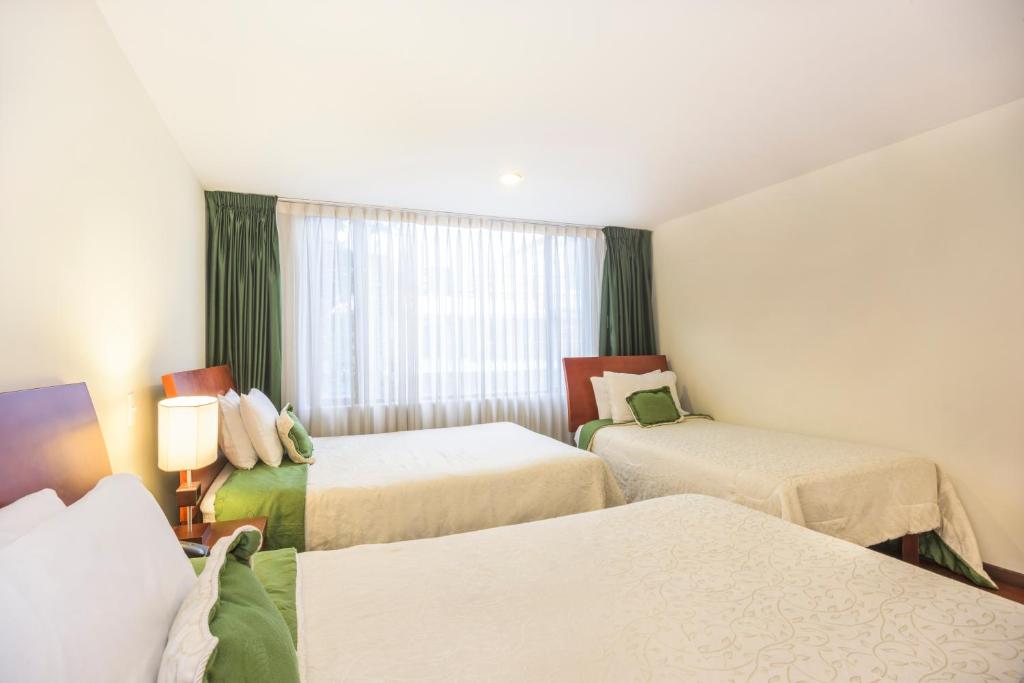 Postel nebo postele na pokoji v ubytování Hotel Portofino