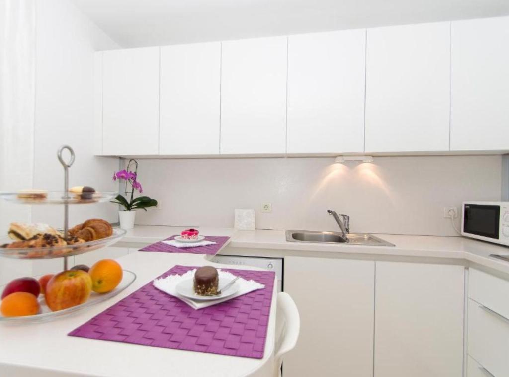 Cuisine ou kitchenette dans l'établissement Apartments Villa Olea
