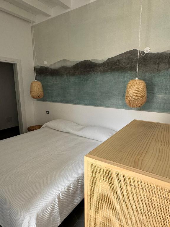 Postel nebo postele na pokoji v ubytování Appartamenti Sparanello