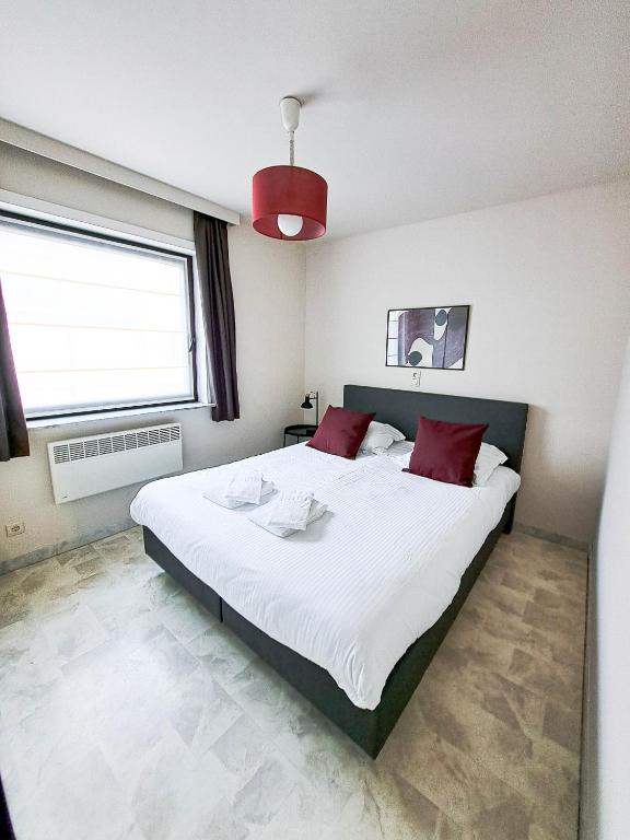 Postel nebo postele na pokoji v ubytování Comfortabel vakantie appartement aan zee - De Zandloper