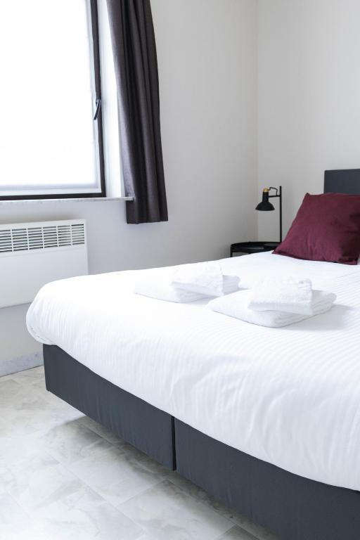 Postel nebo postele na pokoji v ubytování Comfortabel vakantie appartement aan zee - De Zandloper