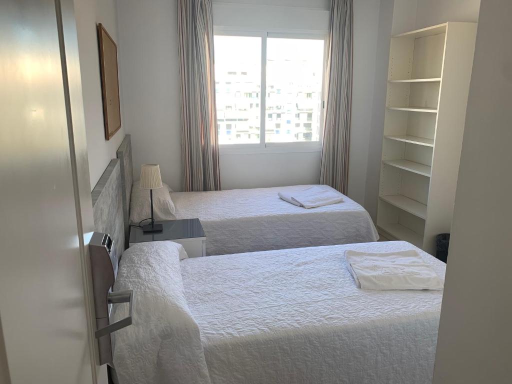 Postel nebo postele na pokoji v ubytování Hostel Residencia Alfil