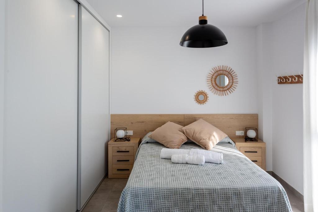 Postel nebo postele na pokoji v ubytování Oliva Suites