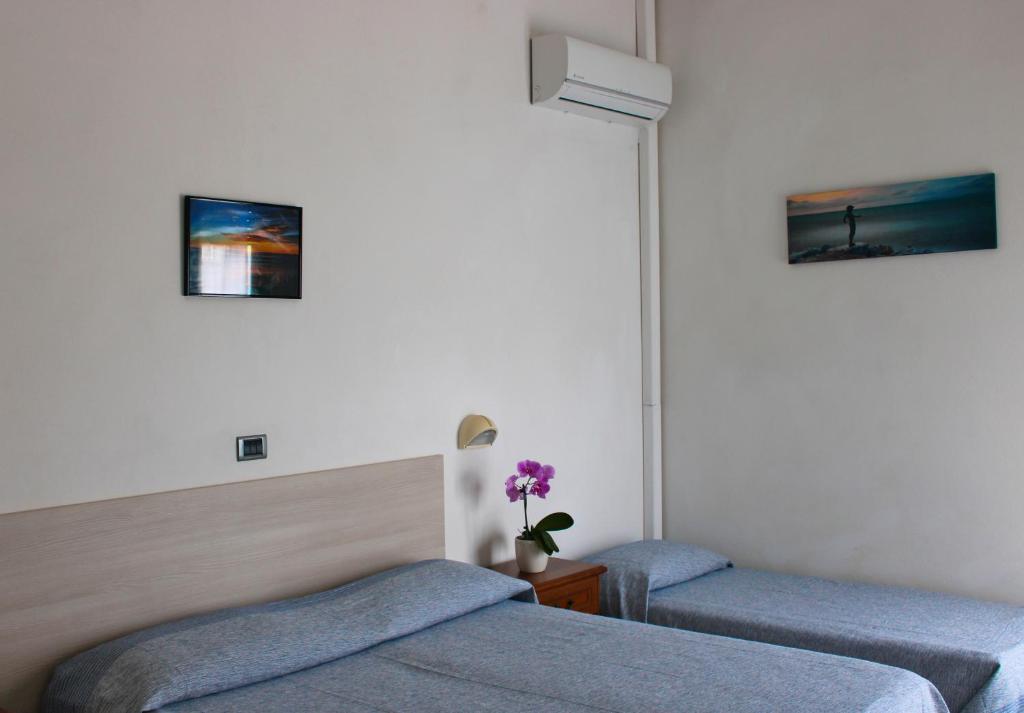 Postel nebo postele na pokoji v ubytování Hotel Puccinelli