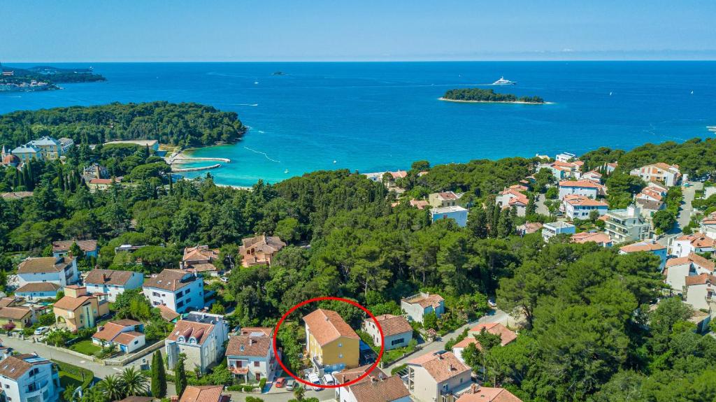 an aerial view of a resort with a red circle at Apartments Villa Borik in Rovinj