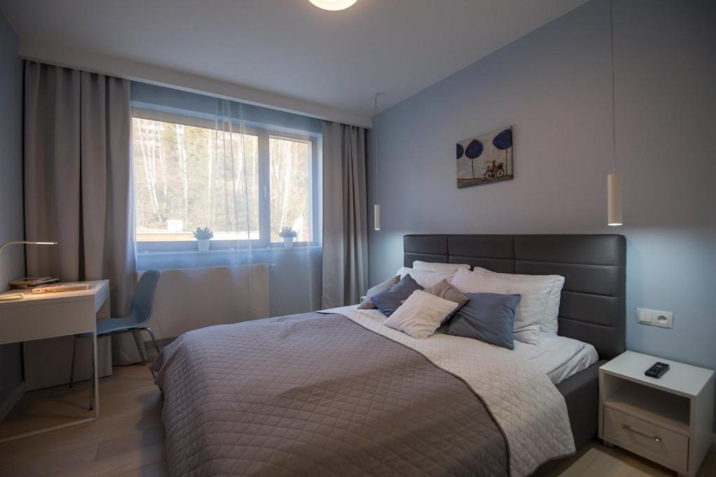 Postel nebo postele na pokoji v ubytování ApartView by Rent like home