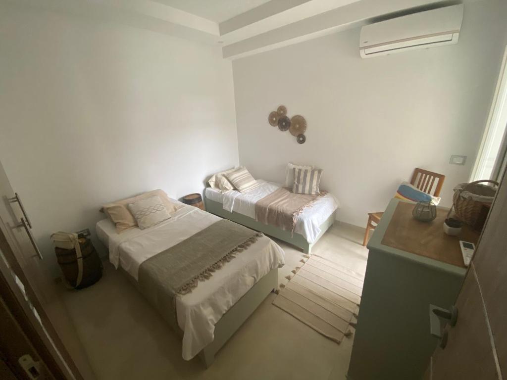 Postel nebo postele na pokoji v ubytování Beach front appartment