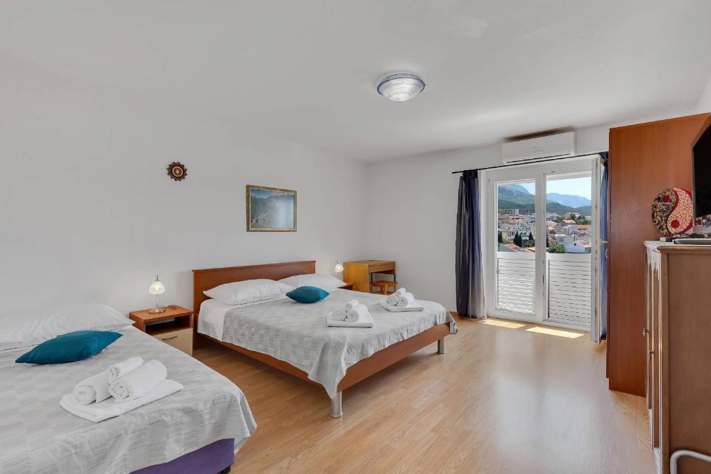 Posteľ alebo postele v izbe v ubytovaní City View Apartment