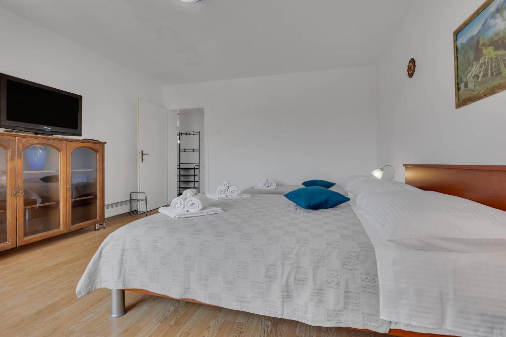 Posteľ alebo postele v izbe v ubytovaní City View Apartment