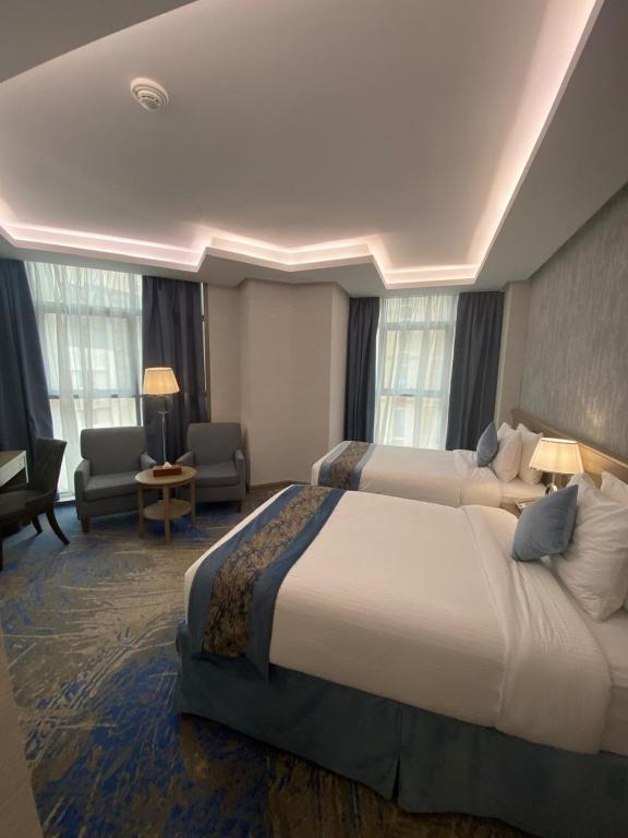 Postel nebo postele na pokoji v ubytování Valy Hotel