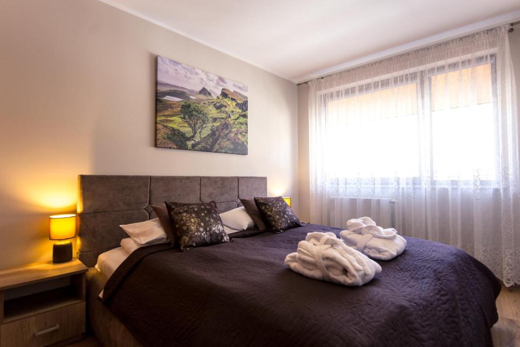Postel nebo postele na pokoji v ubytování ApartView by Rent like home