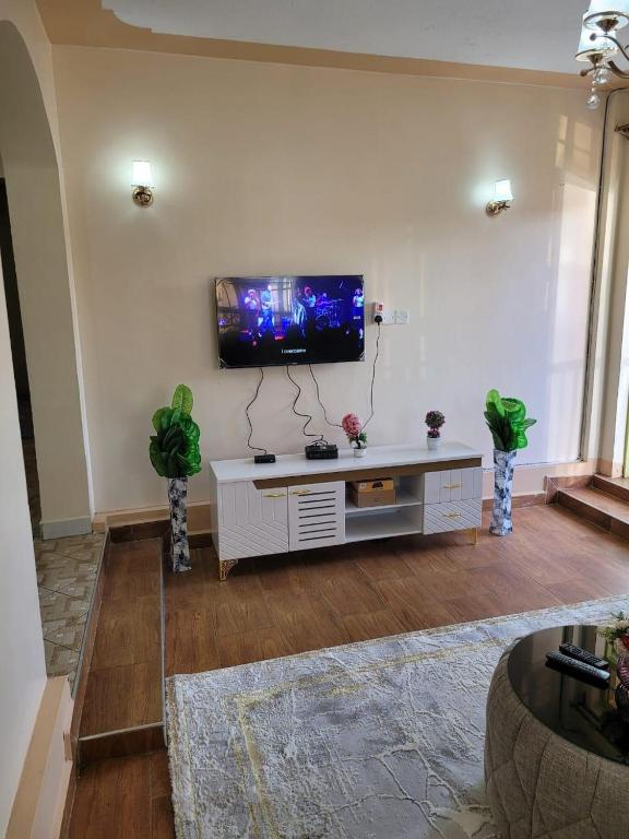 TV a/nebo společenská místnost v ubytování Gloria house