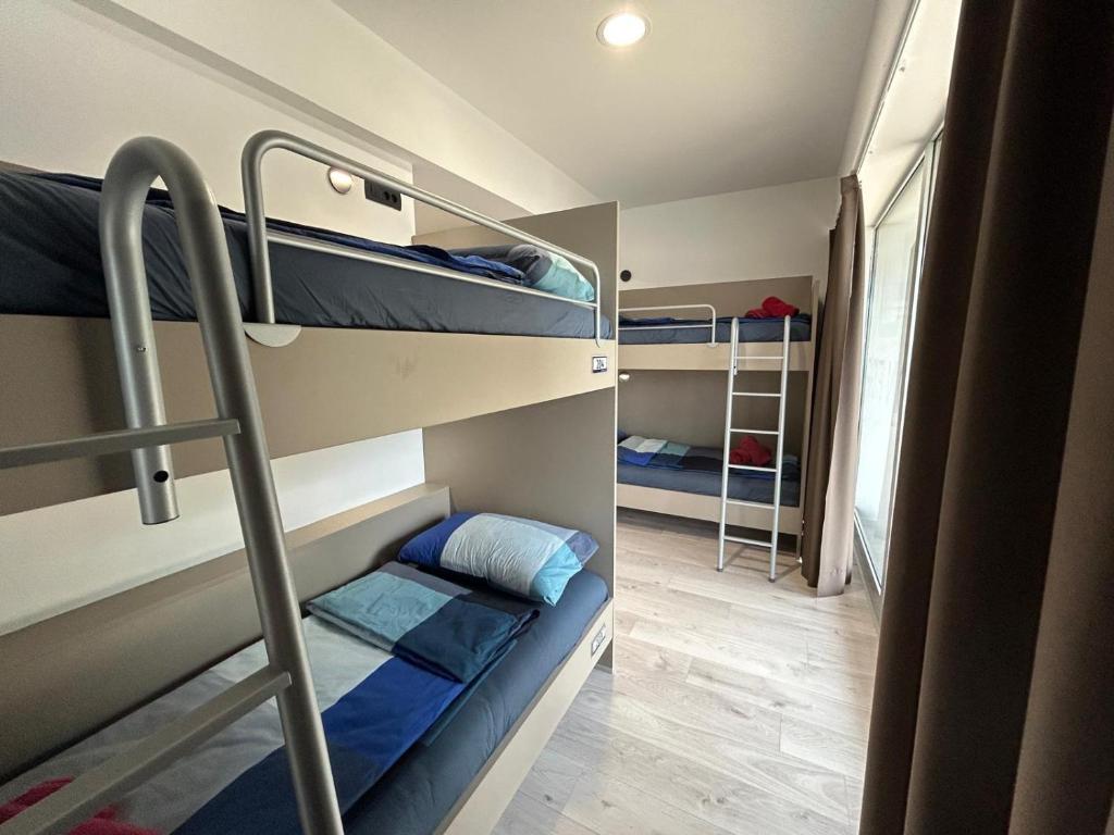 Postel nebo postele na pokoji v ubytování Hostelum