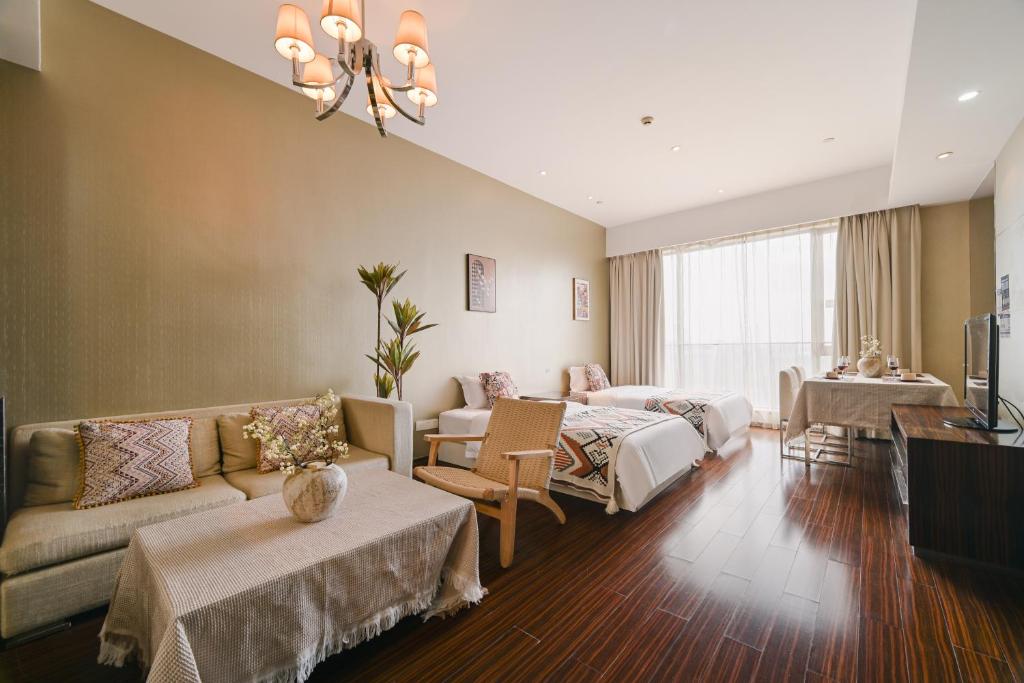 Postel nebo postele na pokoji v ubytování Snug Gaokong Jiangjing Hotel