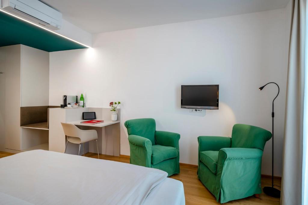 TV a/nebo společenská místnost v ubytování Boutique Hotel Hauser