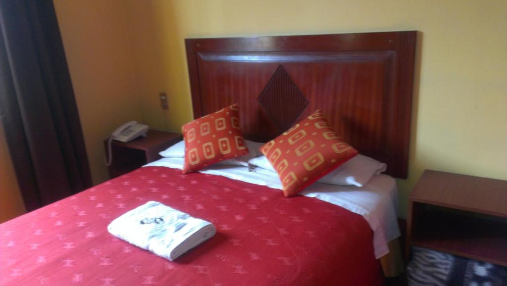Postel nebo postele na pokoji v ubytování Hostal GQ