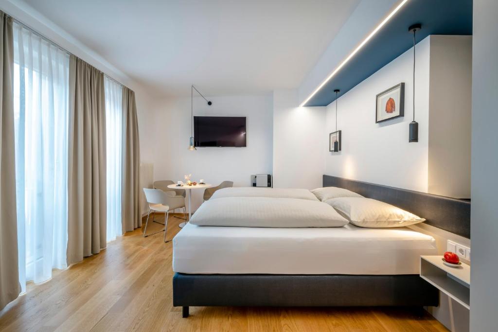 Postel nebo postele na pokoji v ubytování Boutique Hotel Hauser