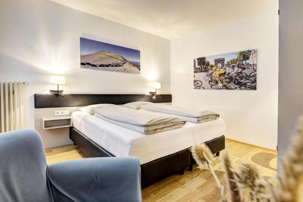 Postel nebo postele na pokoji v ubytování Boutique Hotel Hauser
