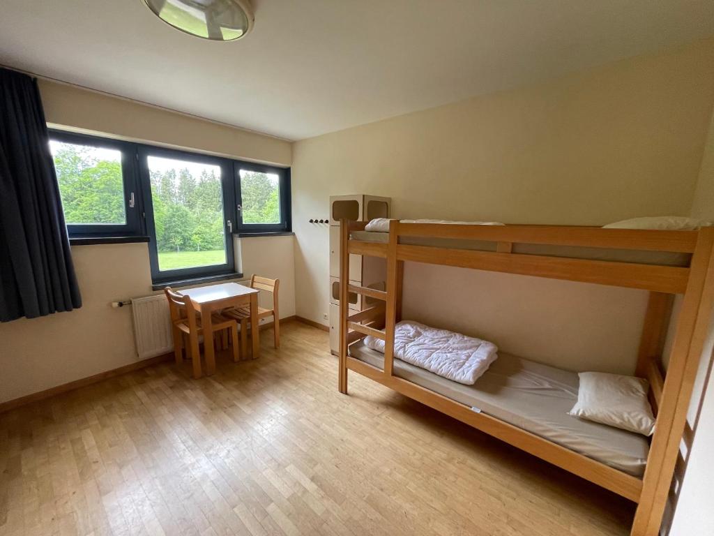 Postel nebo postele na pokoji v ubytování Gîte Kaleo Ovifat