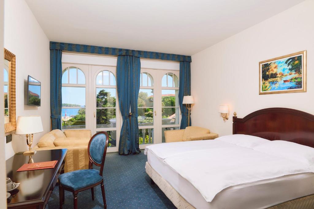 Кровать или кровати в номере Arbiana Heritage Hotel