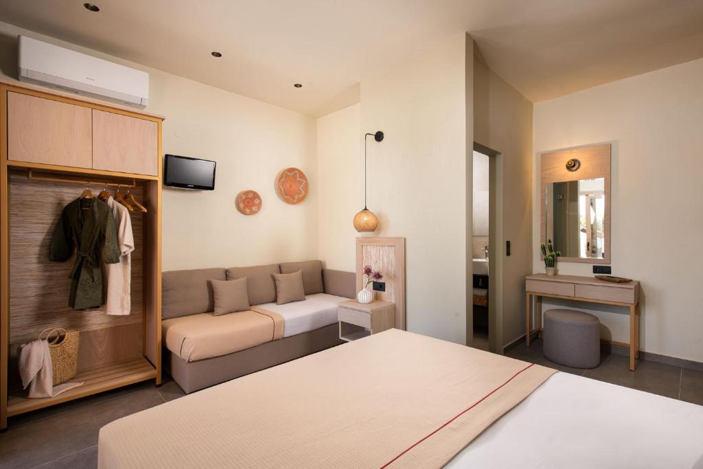 Postel nebo postele na pokoji v ubytování Castaway Suites - Studios Christos