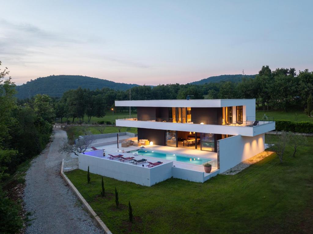 an aerial view of a house with a swimming pool at Villa She Luxury by IstriaLux in Grožnjan
