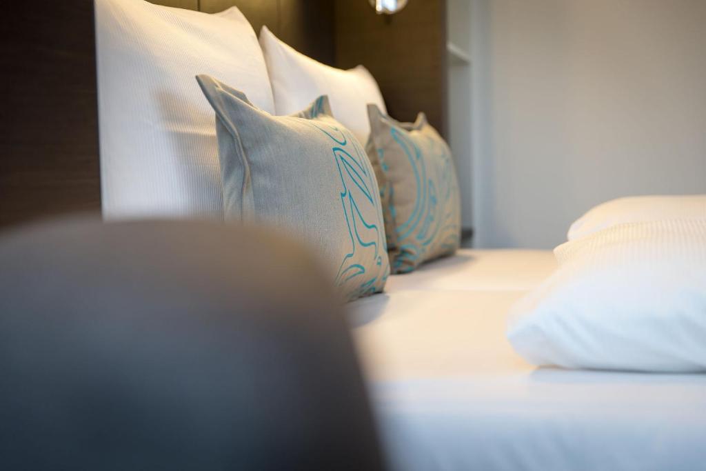 Postel nebo postele na pokoji v ubytování Motel One München-Olympia Gate