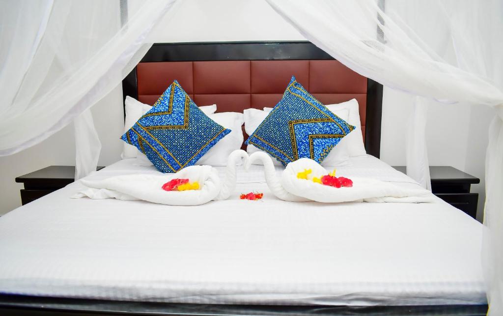 Postel nebo postele na pokoji v ubytování Zanzibar View Hotel