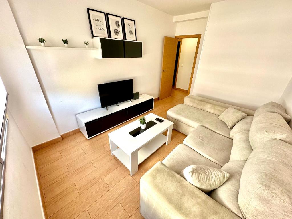 Televízia a/alebo spoločenská miestnosť v ubytovaní Piso Reformado Pontevedra