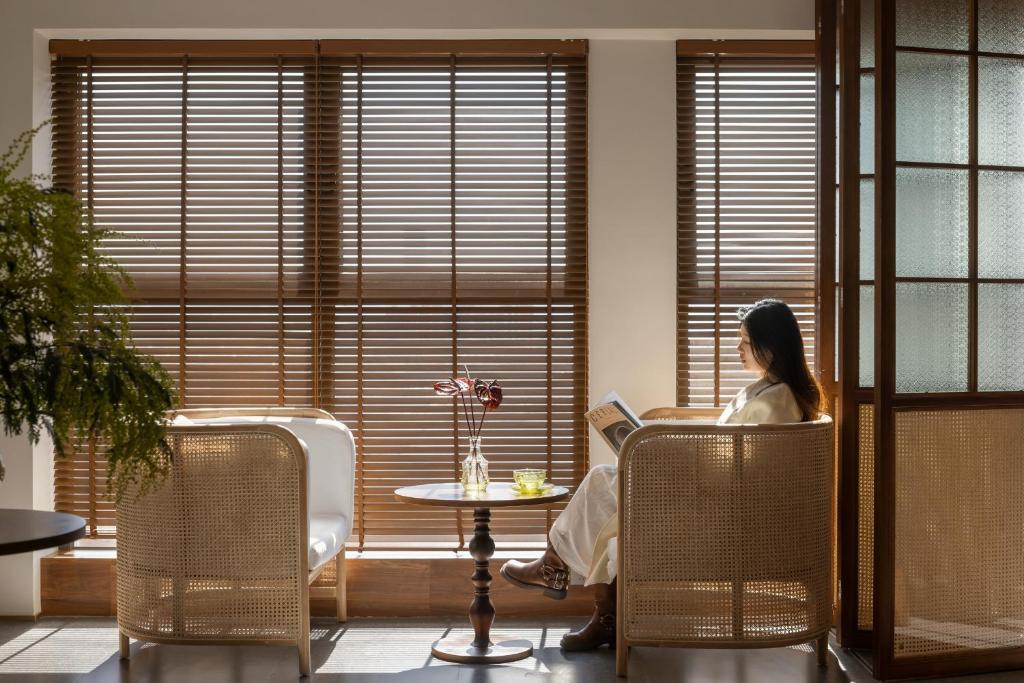Posezení v ubytování 昆明市呈贡区椿屿岚酒店 Chun Yulan Hotel