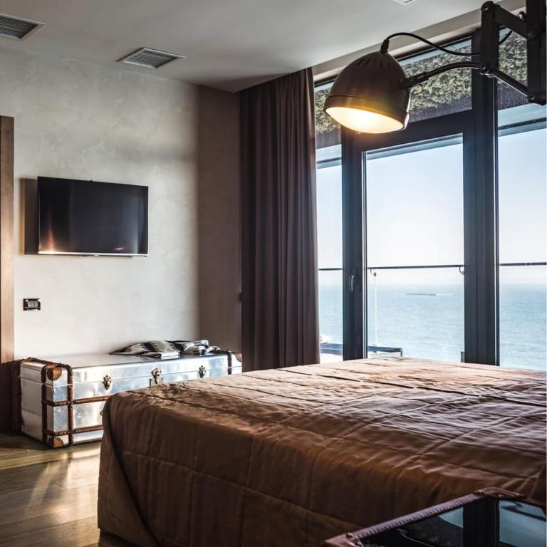 Postel nebo postele na pokoji v ubytování M1 Club Hotel