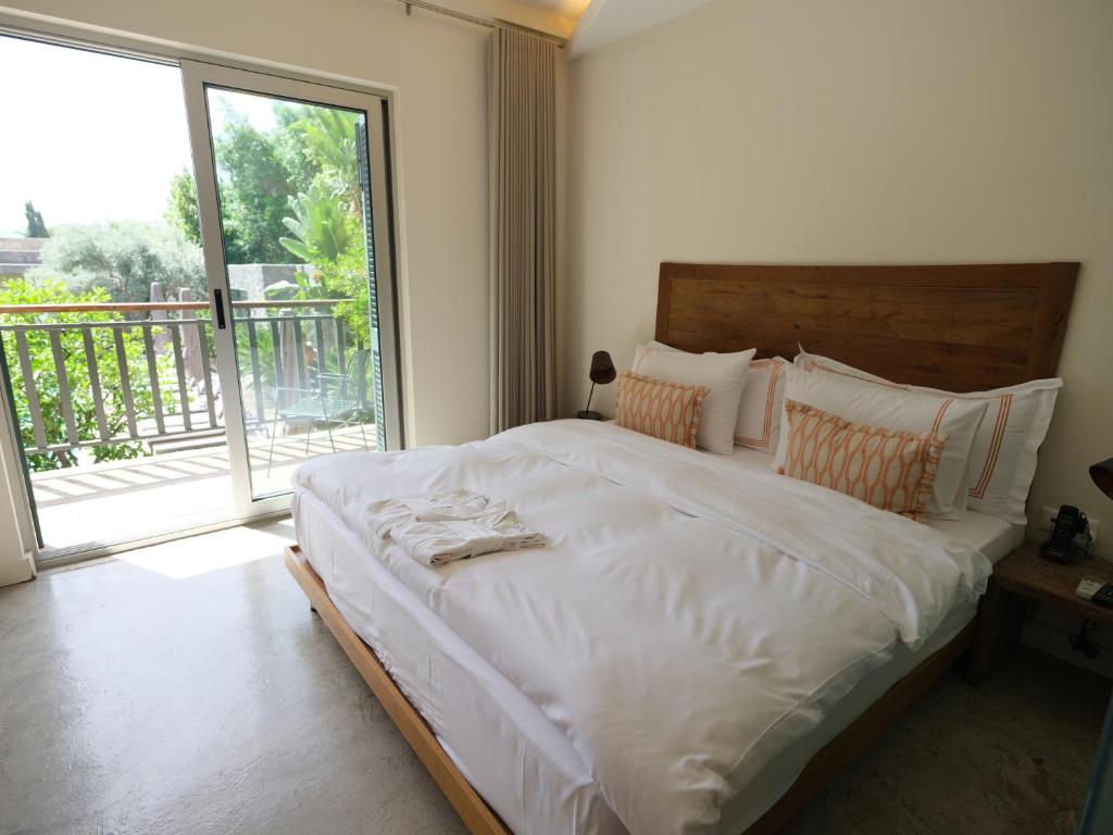 Postel nebo postele na pokoji v ubytování Bella Sombra Hotel