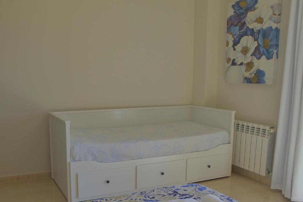Postel nebo postele na pokoji v ubytování Casa Entre Rosales
