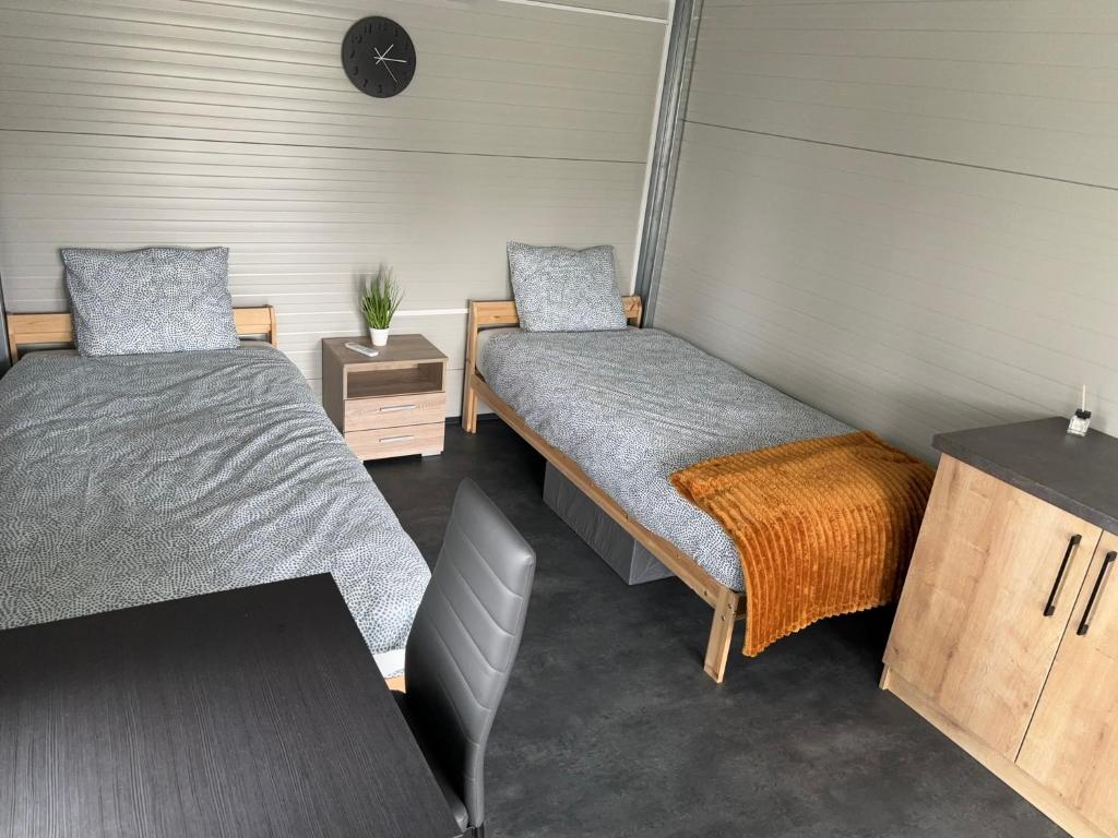 Postel nebo postele na pokoji v ubytování Kaposfuredi Horgaszparadicsom