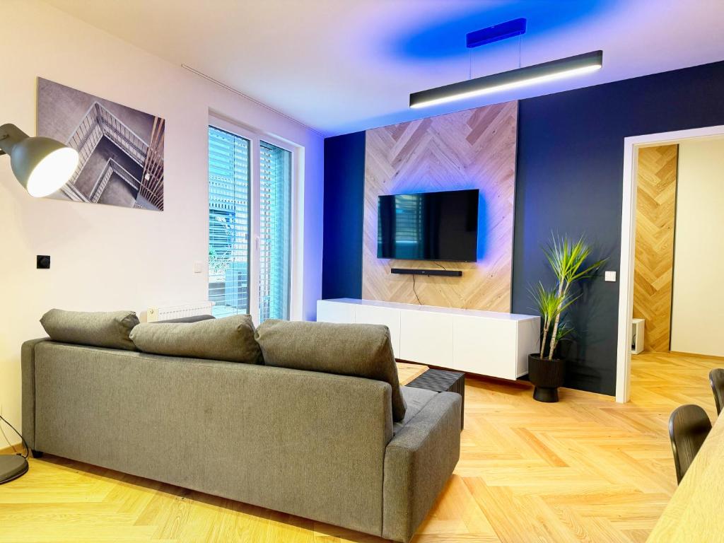 TV a/nebo společenská místnost v ubytování Lakepark Residence