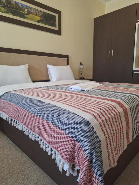 Postel nebo postele na pokoji v ubytování Garni Hotel Ema