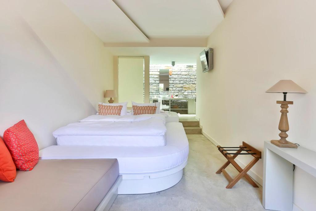 Postel nebo postele na pokoji v ubytování Bella Sombra Hotel