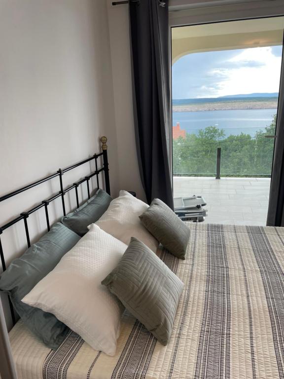 Ένα ή περισσότερα κρεβάτια σε δωμάτιο στο Apartments Sara