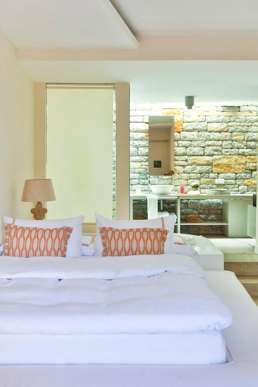Postel nebo postele na pokoji v ubytování Bella Sombra Hotel