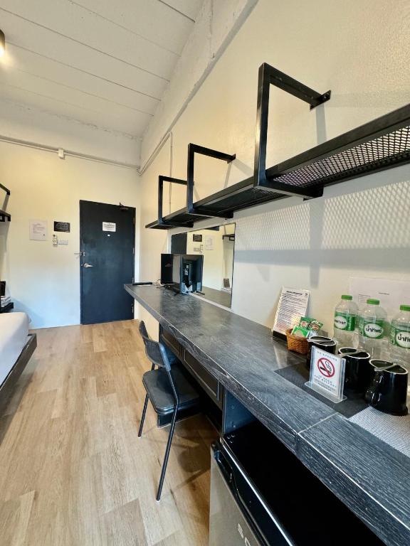 A long in-room counter set up for drinks, storage and seating.