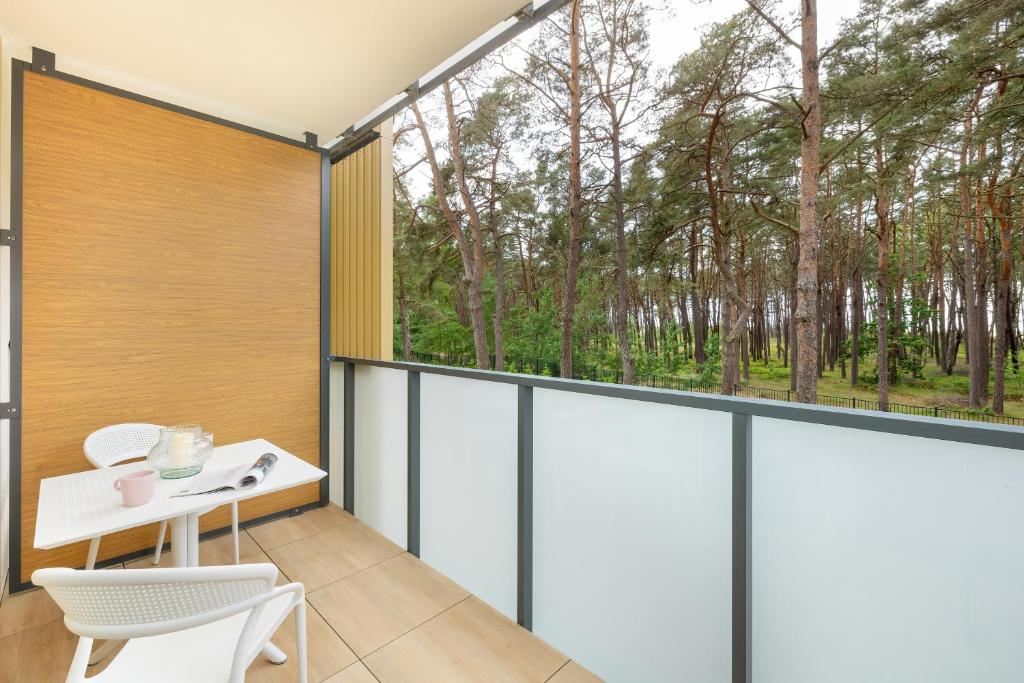 Balkón nebo terasa v ubytování AQUAMARINA DĄBKI Marina Invest