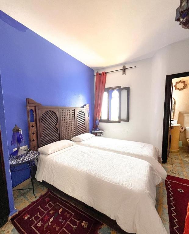 Postel nebo postele na pokoji v ubytování Riad Tassili Chaouen